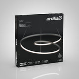 The image shows a black Artika Salto LED pendant light box featuring a spiral-shaped light fixture on the front, with product details and specifications such as 1100 lumens and 50,000 hours lifespan.