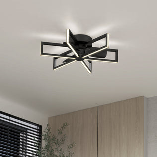 The Artika Swirl 26 in. LED modern ceiling fan with 3 speeds and remote is mounted on a white ceiling above light wood cabinets and a black window blind.