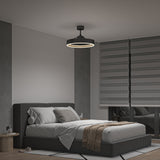 A modern bedroom with a dark upholstered bed, neutral bedding, a brown throw blanket, two round side tables, and large windows covered by horizontal gray blinds. A round ceiling light hangs above the bed.