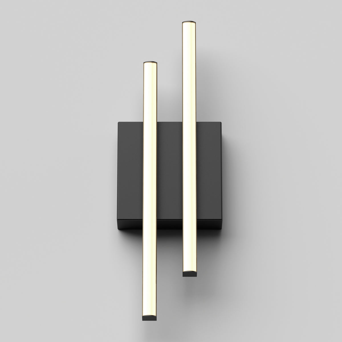 A modern wall light fixture with two parallel, vertical, glowing rods mounted on a rectangular black base against a light gray background.