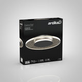 A box for the Artika Essence Disk LED ceiling light, featuring an image of the round, modern light fixture with a sparkling design. The box highlights features like 50,000 hours, dimmable, and 1200 lumens.