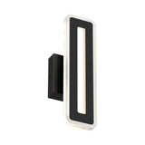 A modern rectangular black wall sconce with a hollow center and rounded edges, mounted vertically on a black base, emits a soft white light from its border.