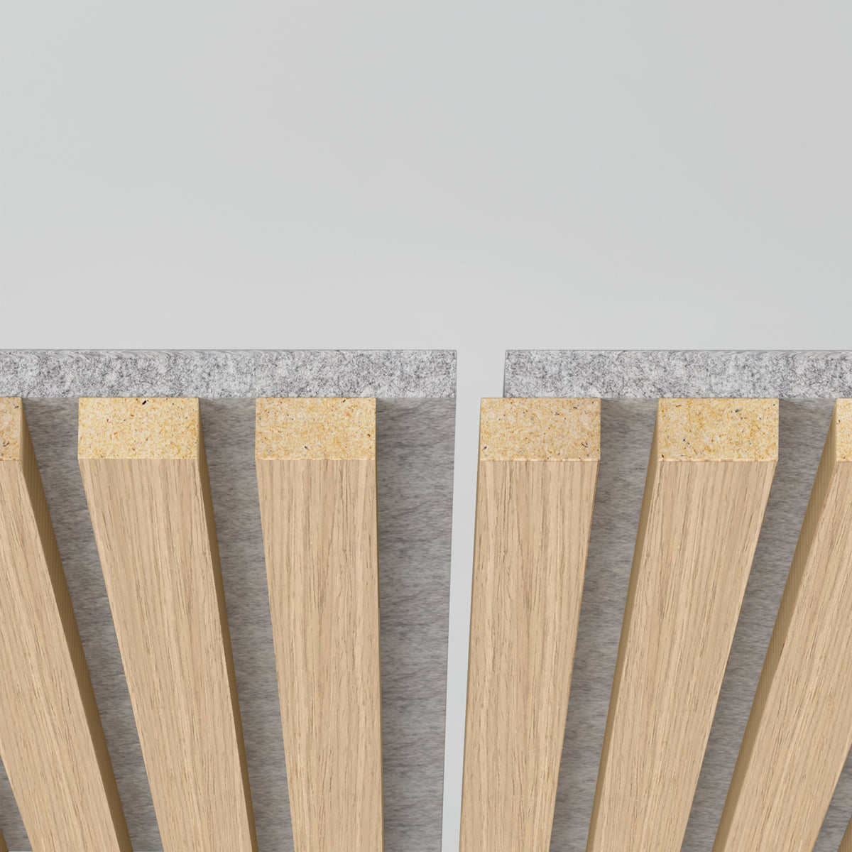 Close-up of two parallel wooden slat panels with a gap between them, mounted on a grey felt backing, against a plain light background.