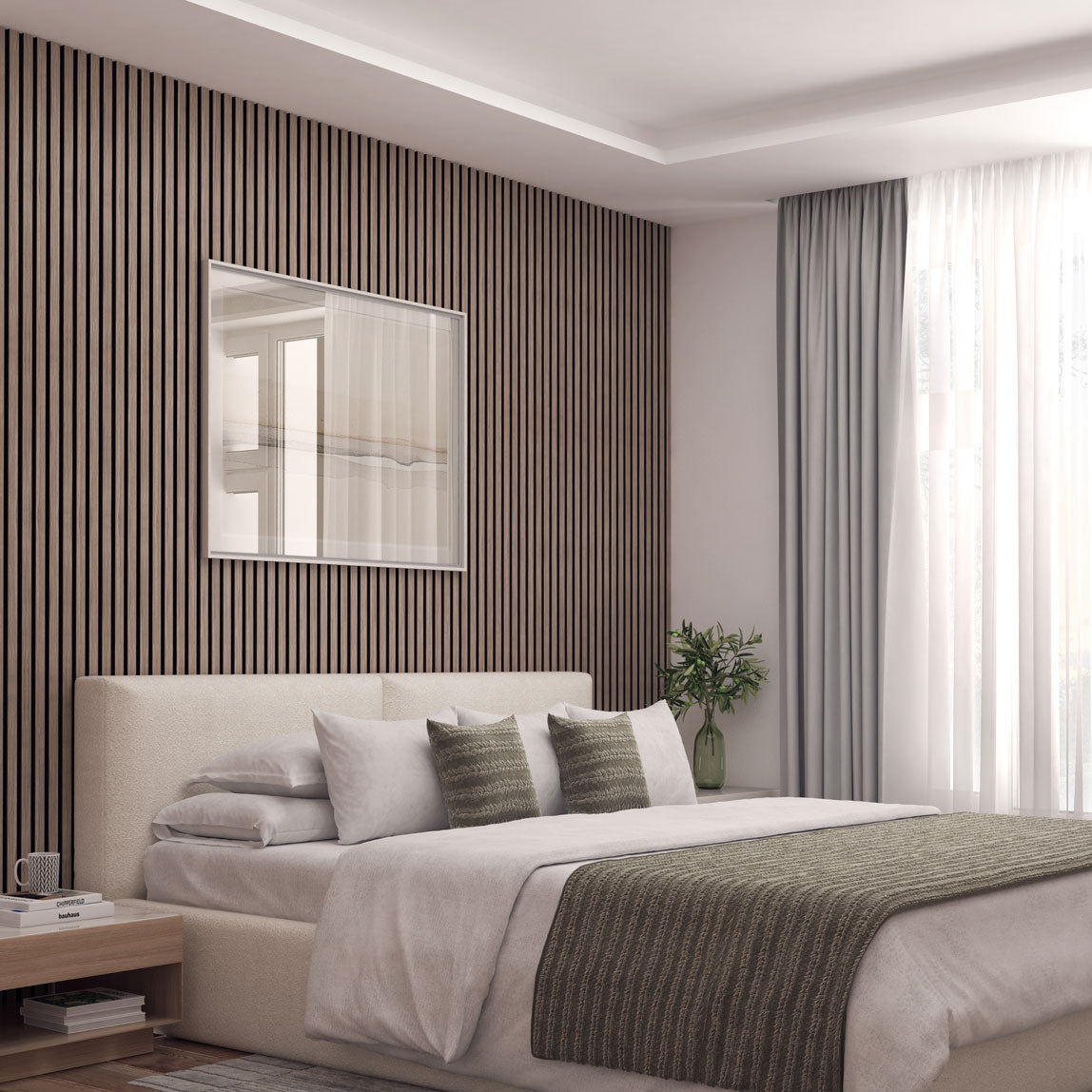 A modern, minimalist bedroom with a beige bed, green-striped pillows and throw, wooden slat accent wall, framed art, light curtains, a small nightstand, and a vase of greenery by a large window letting in natural light.
