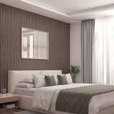 A modern, minimalist bedroom with a beige bed, green-striped pillows and throw, wooden slat accent wall, framed art, light curtains, a small nightstand, and a vase of greenery by a large window letting in natural light.