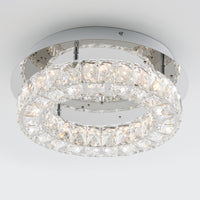 The Artika Celebrity LED flush mount light features two concentric circular rings with crystal accents on a metallic base, providing bright white illumination in a modern ceiling fixture.