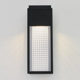 A modern rectangular wall light fixture with a black frame and a perforated white panel, mounted on a light gray wall and emitting soft light from the top and sides.