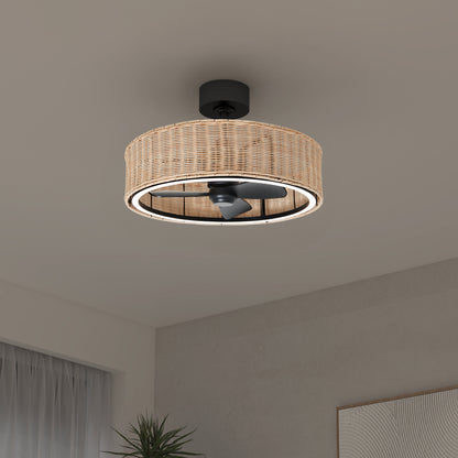 The Artika Kalani 24 in. LED modern ceiling fan, featuring a circular woven rattan cover, 3 speeds, and remote control, is mounted on a white ceiling in a minimalist room.