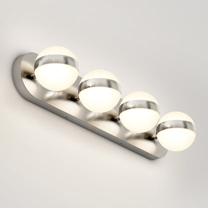 A modern wall-mounted vanity light fixture with four round frosted glass globes, each accented by a metallic band, set on a sleek brushed metal base.
