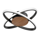 A modern ceiling light fixture with two interlocking oval LED rings, a black base, and a circular wood accent in the center. The design combines black, white, and wood tones for a contemporary look.