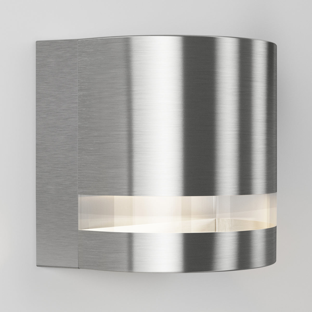 The Artika Valor Round LED indoor-outdoor wall light features a modern, curved design with a brushed metal finish and a horizontal frosted slit that emits soft white light.