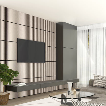 Modern living room featuring an Artika Sonolok 15.5 ft sound-absorbing wall panel kit (4-pack) as a striped accent wall, with a wall-mounted TV, floating shelves, gray sofa, round glass coffee table, tall cabinets, and sheer white curtains.
