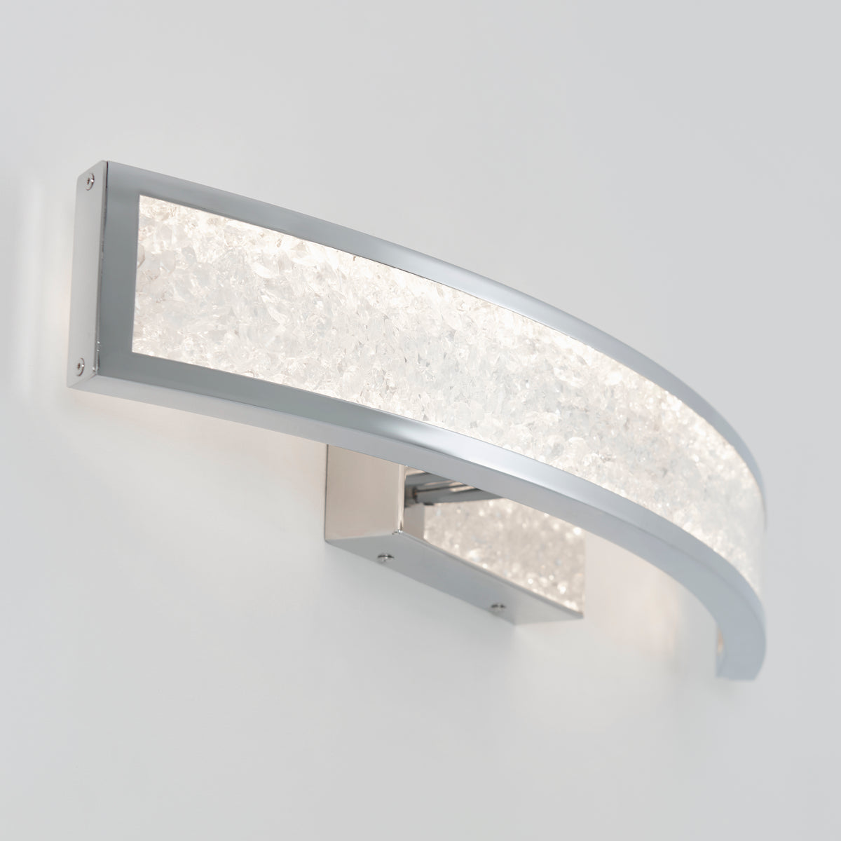The Artika Glitter 27-in (69 cm) Integrated LED Vanity Light Bar features a silver frame and textured, frosted glass, casting soft white light that adds modern style and ambiance to any bathroom.
