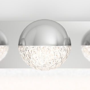 A close-up of the Artika Carat 27-in (69 cm) Integrated LED Vanity Light Bar for Bathroom, featuring a modern chrome finish and faceted glass accents, emitting bright, diffused light.