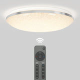 A modern round ceiling light with a textured surface is illuminated. Below it, a remote control with various buttons and a visible Wi-Fi signal icon indicates wireless control capability.