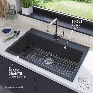 The Artika Baycrest 31 in. Modern Sink in black granite composite sits by the window. Faucet not included.