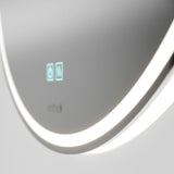 A close-up of a modern, curved device with a glowing LED light strip and a small digital display showing two icons on a smooth, gray surface.