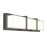 A modern wall-mounted light fixture with a rectangular black metal frame and three frosted glass panels, evenly spaced, emitting a soft white light.