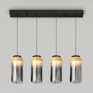 The Artika Hanson 4-light LED pendant features four cylindrical smoked glass shades with wooden accents, suspended from a rectangular black base. This modern fixture offers 5 CCT options for customizable lighting.