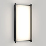 A modern wall sconce light fixture with a rectangular, frosted white diffuser framed by a black metal border, mounted on a plain light gray wall.