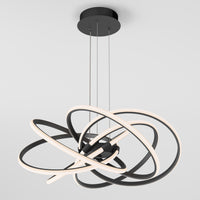 The Artika Maelstrom LED pendant light features intertwined black rings with integrated LED strips, suspended by three thin cables, shown against a plain white background.