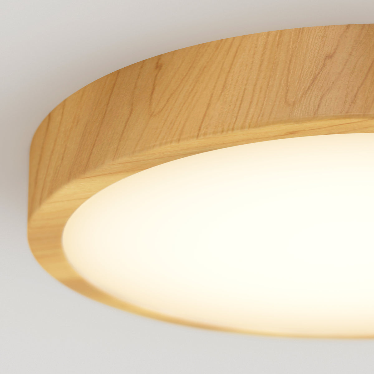 Close-up of a round ceiling light fixture with a wooden frame and a soft, white glowing surface, mounted on a white ceiling.
