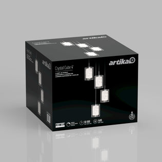A black Artika box displays images of the Crystal Cube 4-light LED pendant, its name, and icons showing key features like a 50,000-hour lifespan and 1600 lumens.