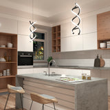 Modern kitchen with white cabinets, wooden accents, and a concrete island with two wooden bar stools. Unique DNA-shaped pendant lights hang above the island, and open shelves display dishes and glassware.