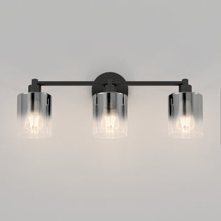 The Artika Haze modern 3-light bathroom vanity light features three exposed bulbs in cylindrical clear glass shades, mounted on a sleek horizontal black metal bar.