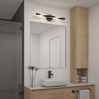 Modern bathroom featuring the Artika Finley LED modern bathroom vanity light, large mirror, vessel sink with black faucet, wooden vanity, wall-mounted cabinet, folded towels, and a glass shower visible on the left.
