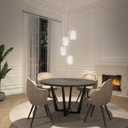 Elegant dining room with a round black table, four beige upholstered chairs, Artika Crystal Cube 4-light LED pendant light, a lit fireplace, large window with sheer curtains, and a potted plant in the corner.