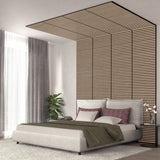 A modern bedroom with a large bed, gray and mauve pillows, a green blanket, and a vertical wood slat feature wall extending onto the ceiling. A plant and orchid decor sit near the window with gray curtains.