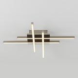 A modern ceiling light fixture with intersecting horizontal and vertical metal bars, each with integrated LED lighting, mounted on a square base against a plain light background.