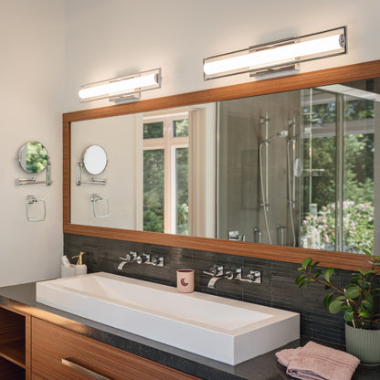 Modern bathroom with a double faucet sink and Artika Rialto 27-in LED 3-CCT Vanity Light Bar installed above a large mirror.