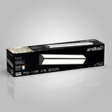 A rectangular Artika Preston LED vanity light box is shown on a gray background. The black packaging displays an image of the light, product details, and specifications including brightness, wattage, and lifespan.