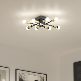 The Aristo LED flush mount 3 CCT by Artika features eight exposed bulbs, gold accents, and adjustable color temperature.