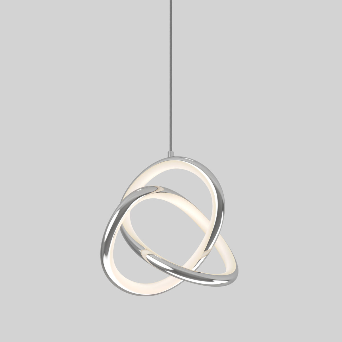 The Artika Zephyr LED pendant features two interlocking oval rings—one glowing white, one metallic silver—suspended from a slim cord against a plain gray background.