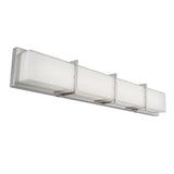 A modern wall-mounted light fixture with four rectangular frosted glass shades and a sleek metal base, suitable for bathrooms or hallways.