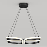 A modern ceiling pendant light with two intertwined black and white oval LED rings, suspended by four black cords from a round black ceiling mount against a plain light gray background.