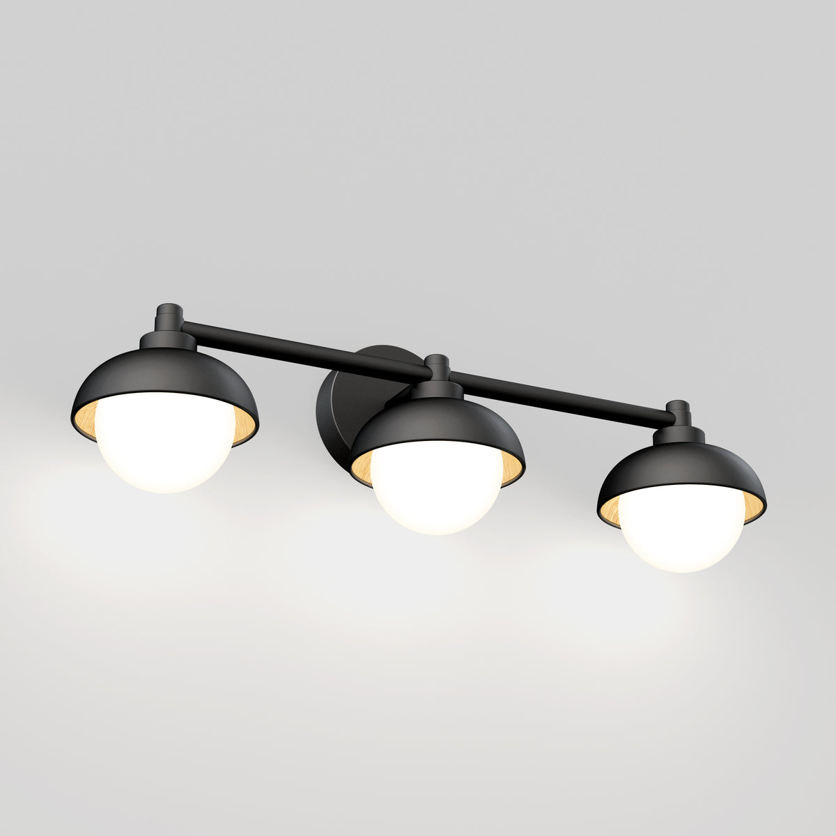 The Artika Boden 27-in (69 cm) Integrated LED 5-CCT Vanity Light Bar features three black and white round lampshades on a horizontal rod, each offering adjustable color temperature for a warm glow—ideal for modern bathrooms.