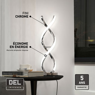 Artika Swirl LED table lamp delivers ambient light on a side table by a window; includes 5-year warranty.