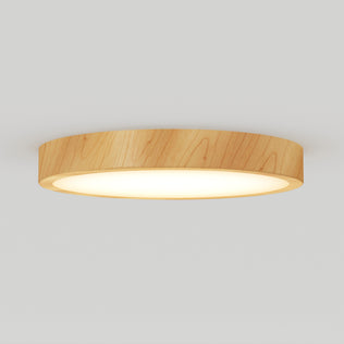 The Artika Dryad 15 in. LED Modern flush mount light features a round wooden frame and a soft white illuminated surface, creating a stylish look on any light-colored ceiling.