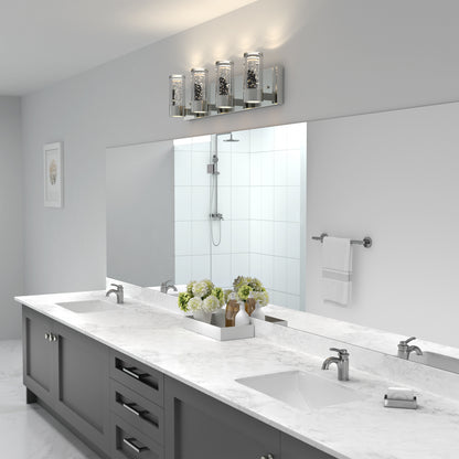 Modern bathroom with double sinks, marble countertop, and Essence 27-in Artika LED vanity light illuminating a large mirror.