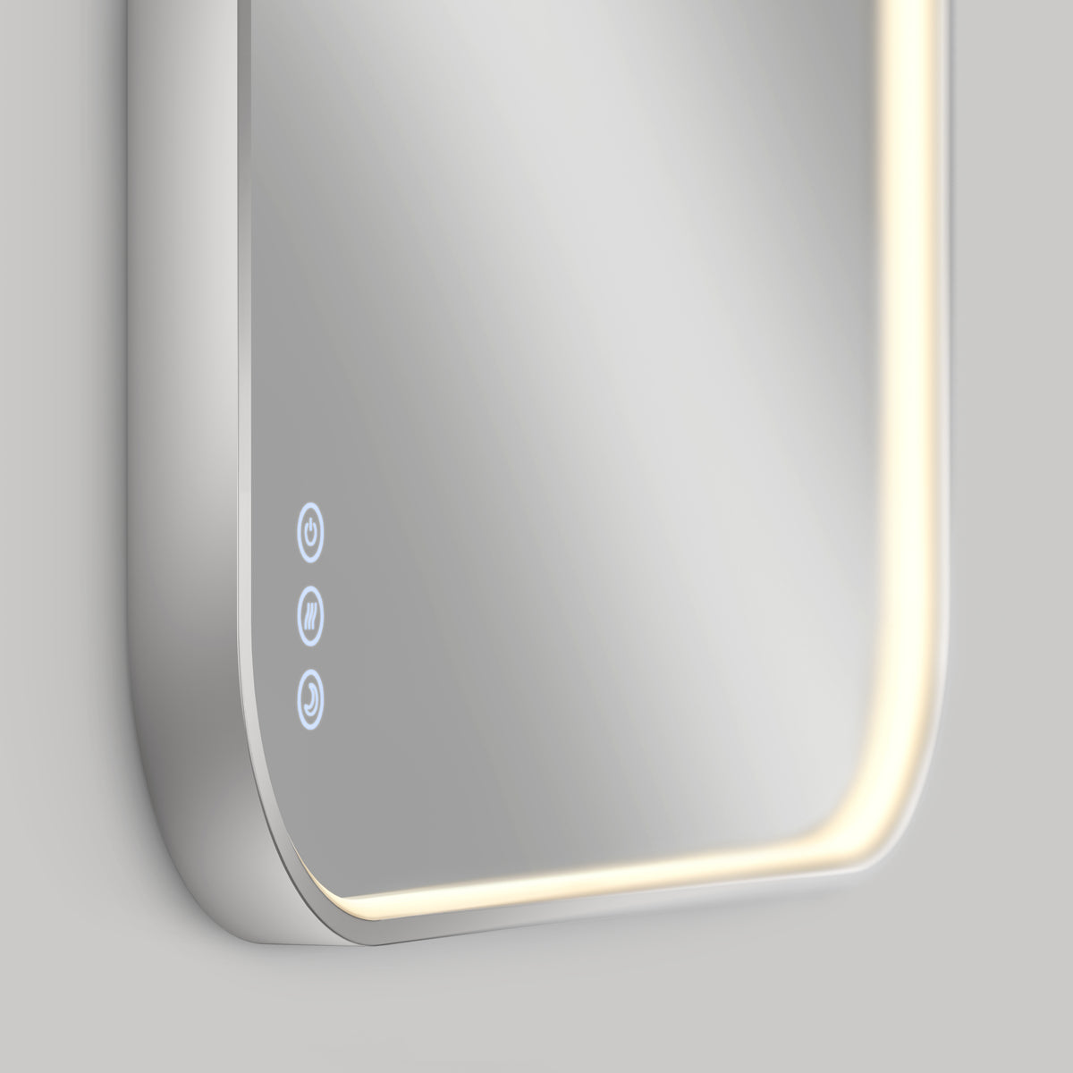 A close-up of the Artika Royce Dimmable LED Mirror, 3 CCT, with rounded edges and blue touch controls on the lower left. Mounted horizontally on a light gray wall, it features soft, adjustable LED lighting.