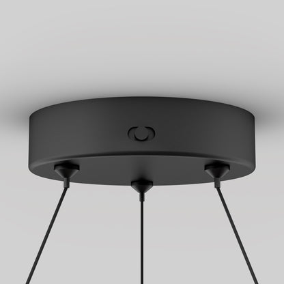 A close-up of the Artika Bjorn modern LED pendant light 5 CCT shows three cables hanging from a round black ceiling mount against a plain light background.