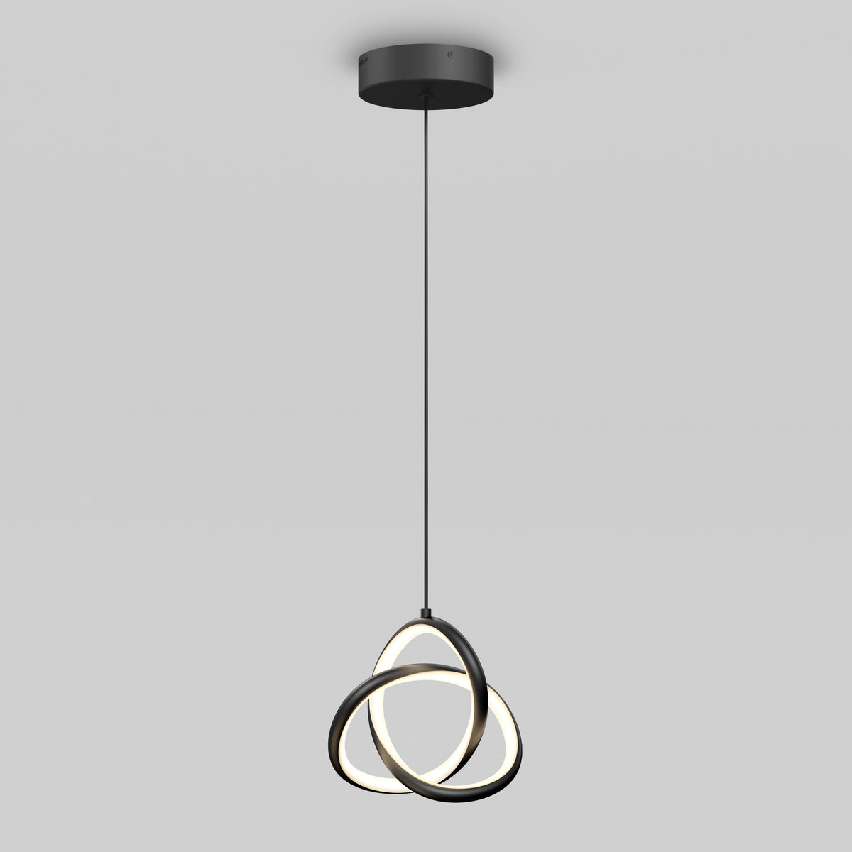 The Artika Zephyr LED pendant features a black circular ceiling mount, a single black cord, and three interlocking illuminated rings forming a modern sculptural design, shown against a plain light gray background.