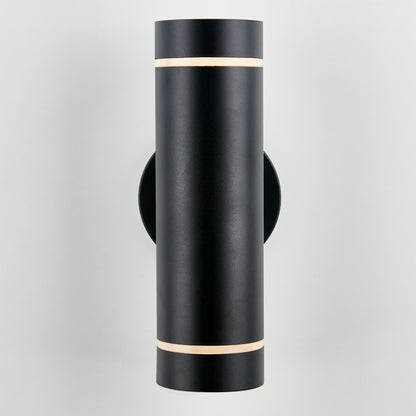 The Artika C7 indoor-outdoor wall light is a modern black cylindrical sconce with slim horizontal light gaps at the top and bottom, shown mounted on a plain white wall.