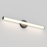 A modern, minimalist wall-mounted LED light fixture with a long, horizontal bar and a round black base, emitting a soft white glow against a plain light gray wall.