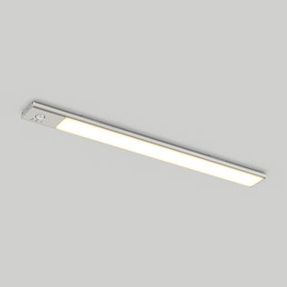 The Artika Outline under cabinet LED light 3CCT casts a soft, warm white glow beneath cabinets, illuminating the plain light gray ceiling with its modern, slim rectangular design.