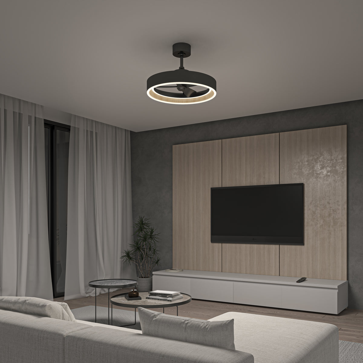 A modern living room with a circular ceiling light, gray walls, wood paneling behind a wall-mounted TV, white media console, light gray sofa, round coffee tables, tall plant, and floor-to-ceiling curtains.